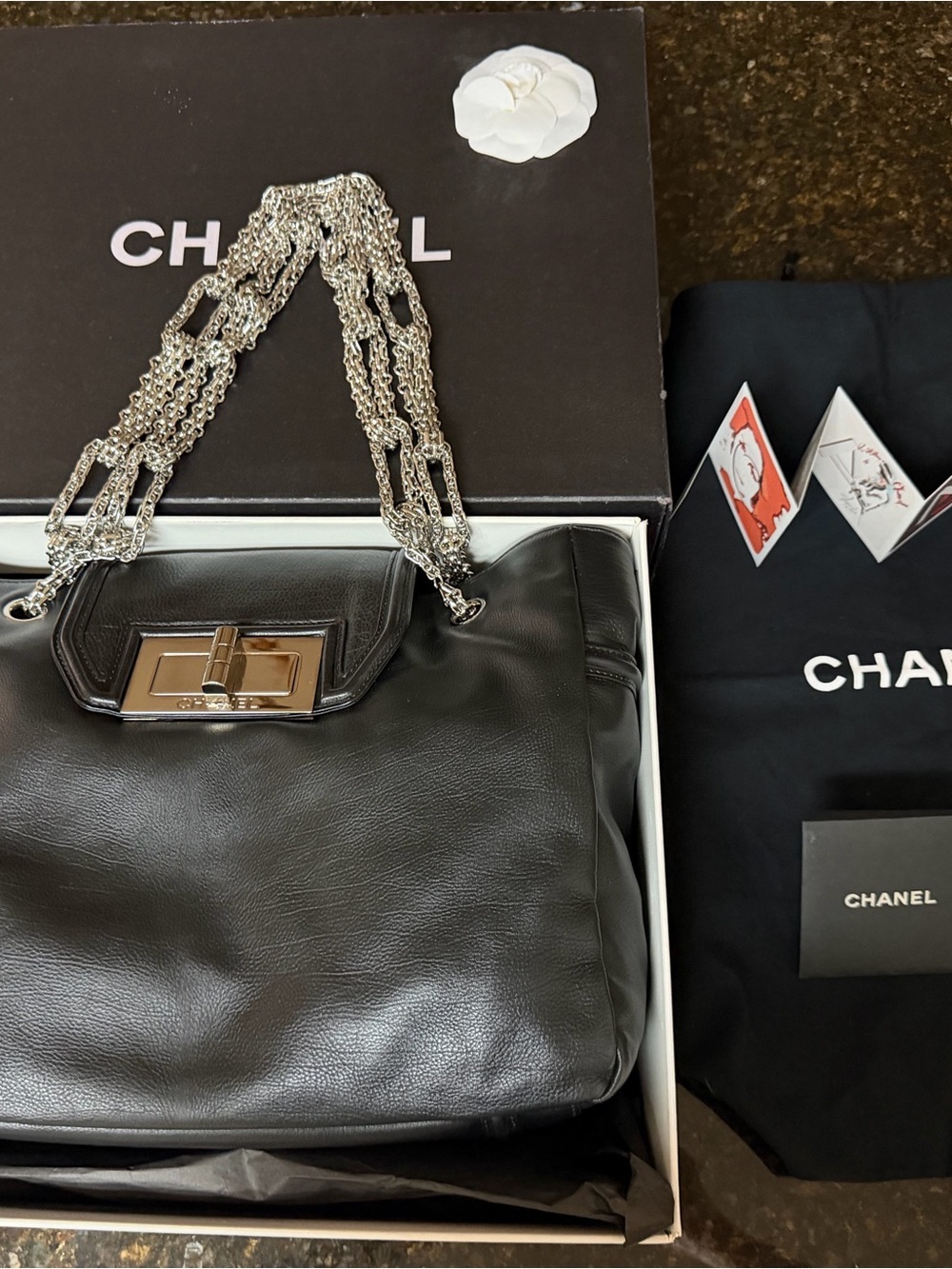 CHANEL Black Leather Shoulder Bag with Silver Chain Detail